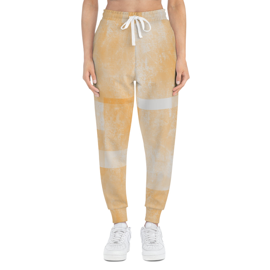 Peach tie-dye athletic joggers with white drawstring and cuffed ankle hems