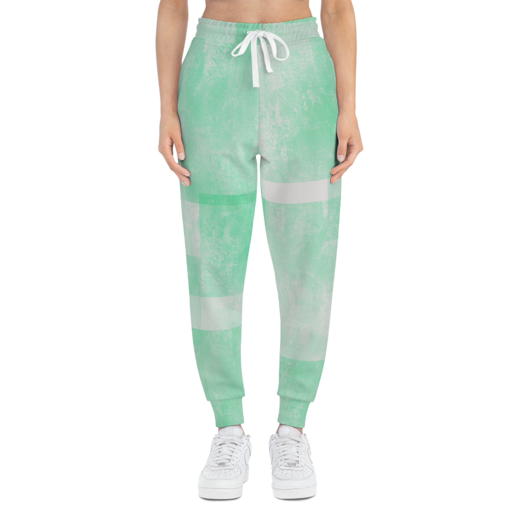 Mint green tie-dye athletic joggers with drawstring waist and stripe blocks
