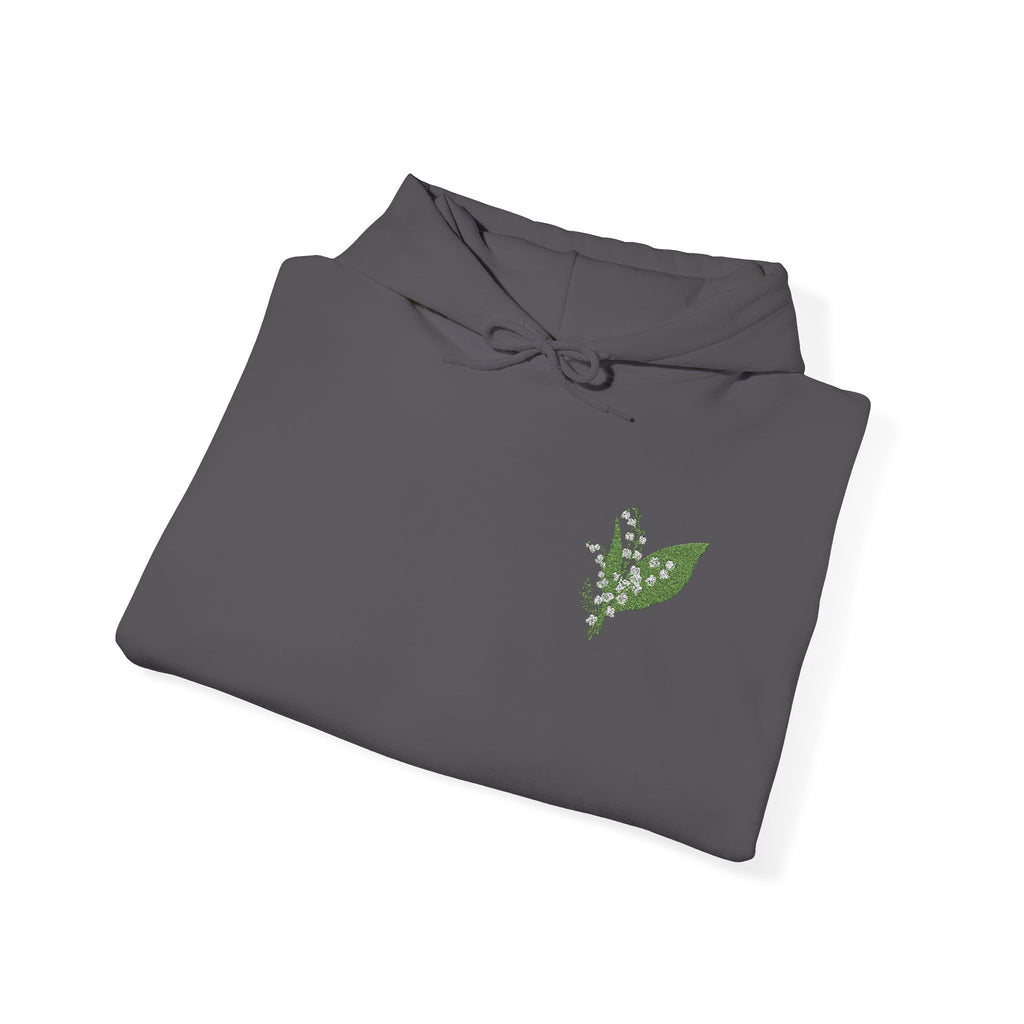 Charcoal hoodie flat lay with hood drawstrings and green leaf embroidery on chest