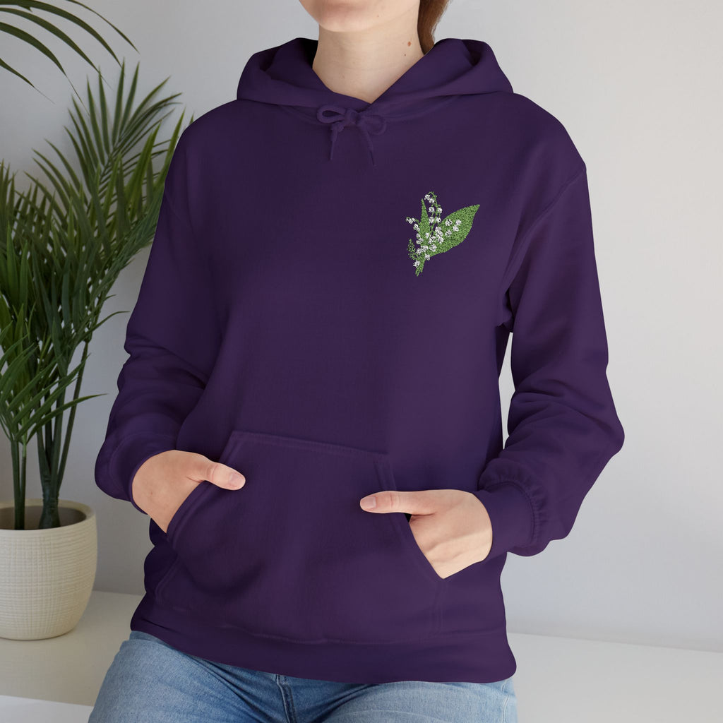 Purple hoodie with green leaf chest embroidery, drawstring hood, and front pouch pocket