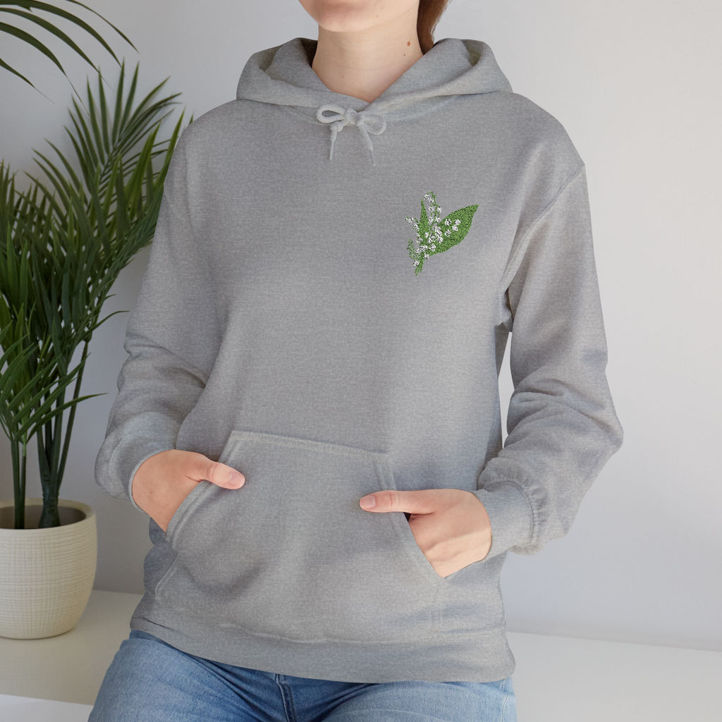 Sport Grey pullover hoodie with green leaf embroidery, close-up of chest and hood drawcord