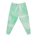 Mint green tie-dye joggers, front view: elastic waist, white drawstring, block stripes