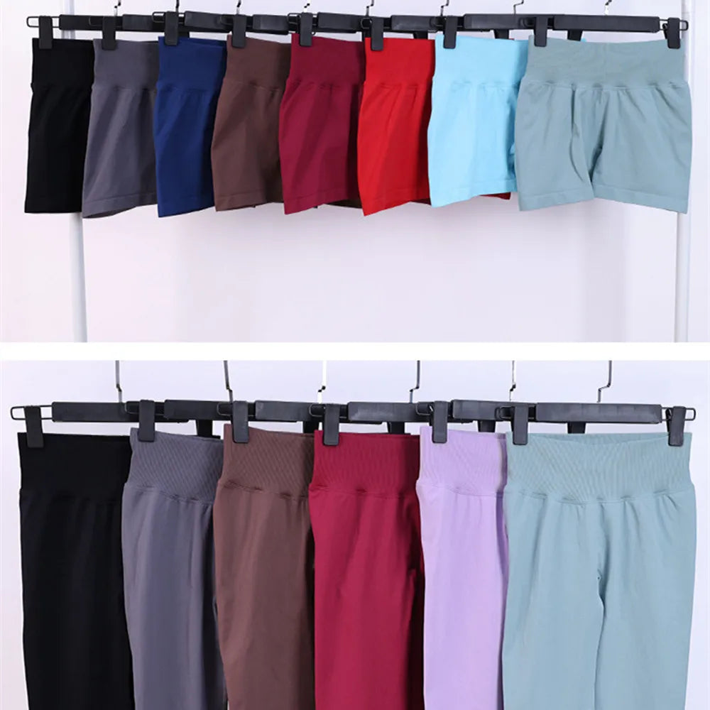 Matching active shorts set, hanging on clips in black, gray, blue, and red tones