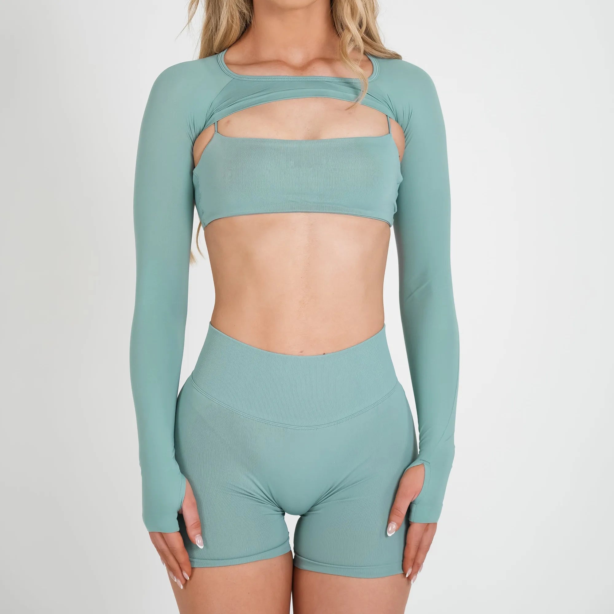 Teal thin-strap sports bra, long-sleeve cover top and matching shorts set