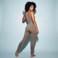 Tan matching workout set: racerback tank top and ankle-length leggings