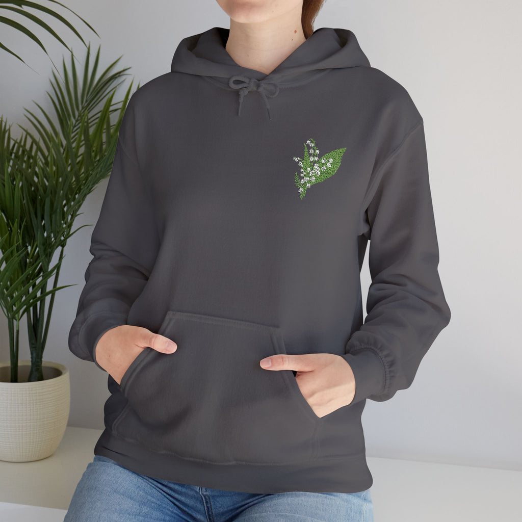 Charcoal hooded sweatshirt with green leaf embroidery on chest, front view