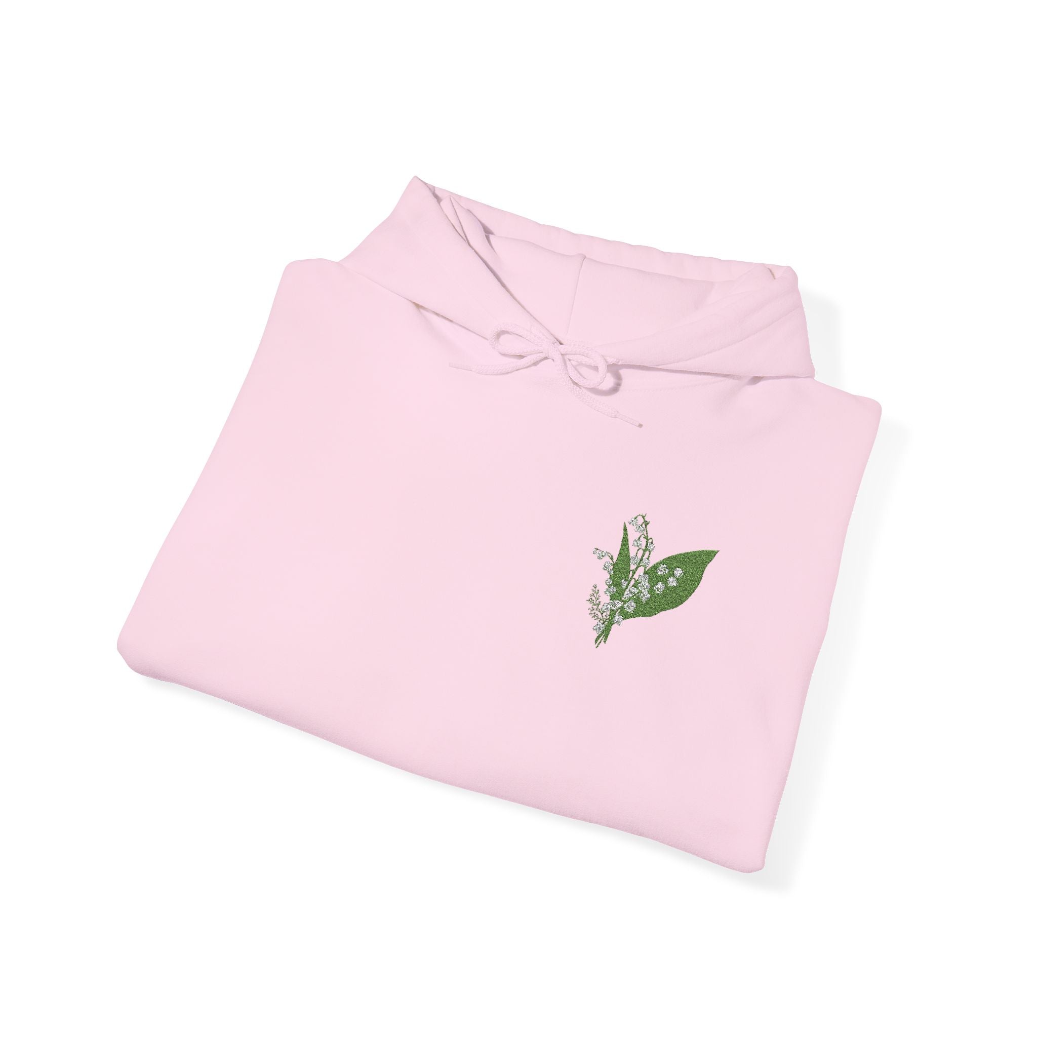 Light pink hoodie folded flat with green leaf chest embroidery and drawstring hood