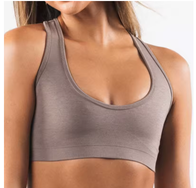 Gray sports bra worn by a person on a white background
