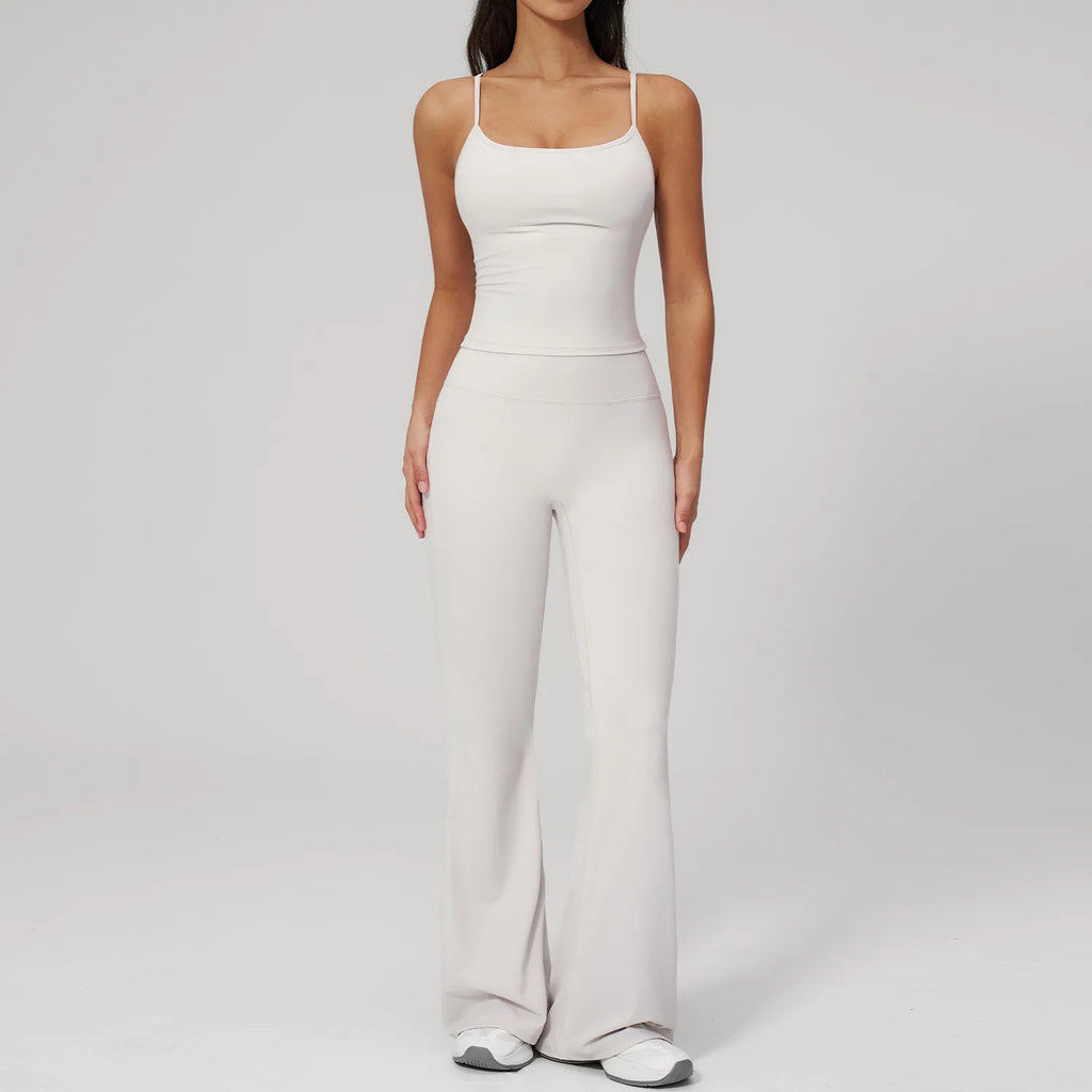 Women’s white sports tank and flared legging set, front view