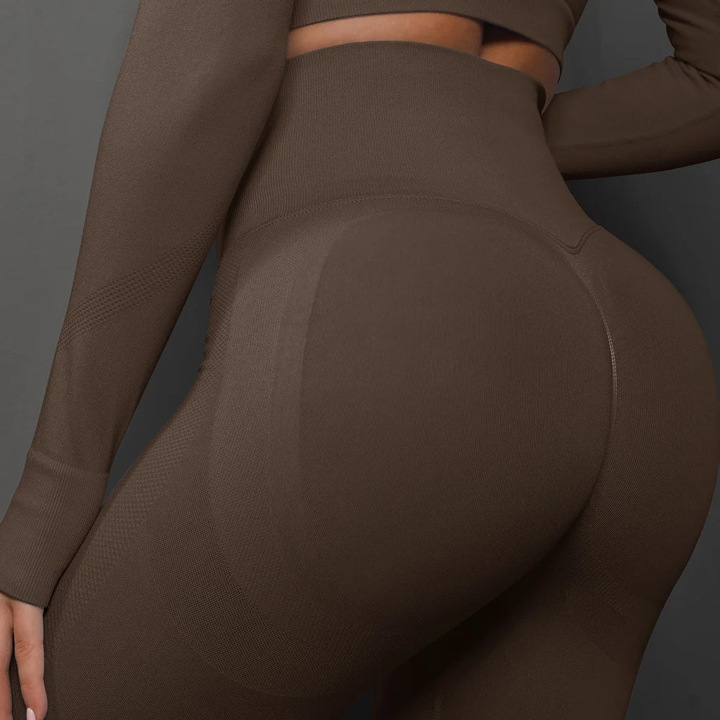 High-waist brown seamless yoga leggings close-up, scrunch back and smooth texture