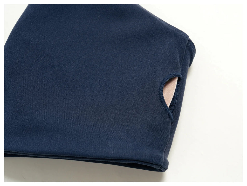 Navy yoga bra close-up with cutout side opening and soft stretch fabric