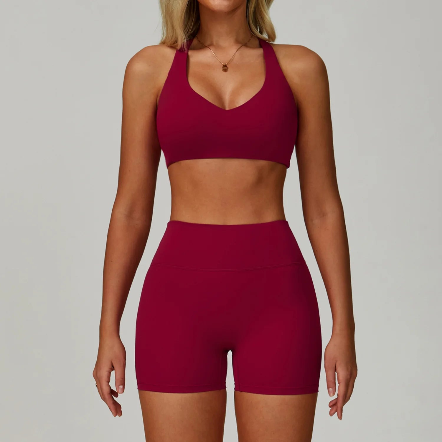 Rose Red sports bralette and high-waisted active shorts set, front view
