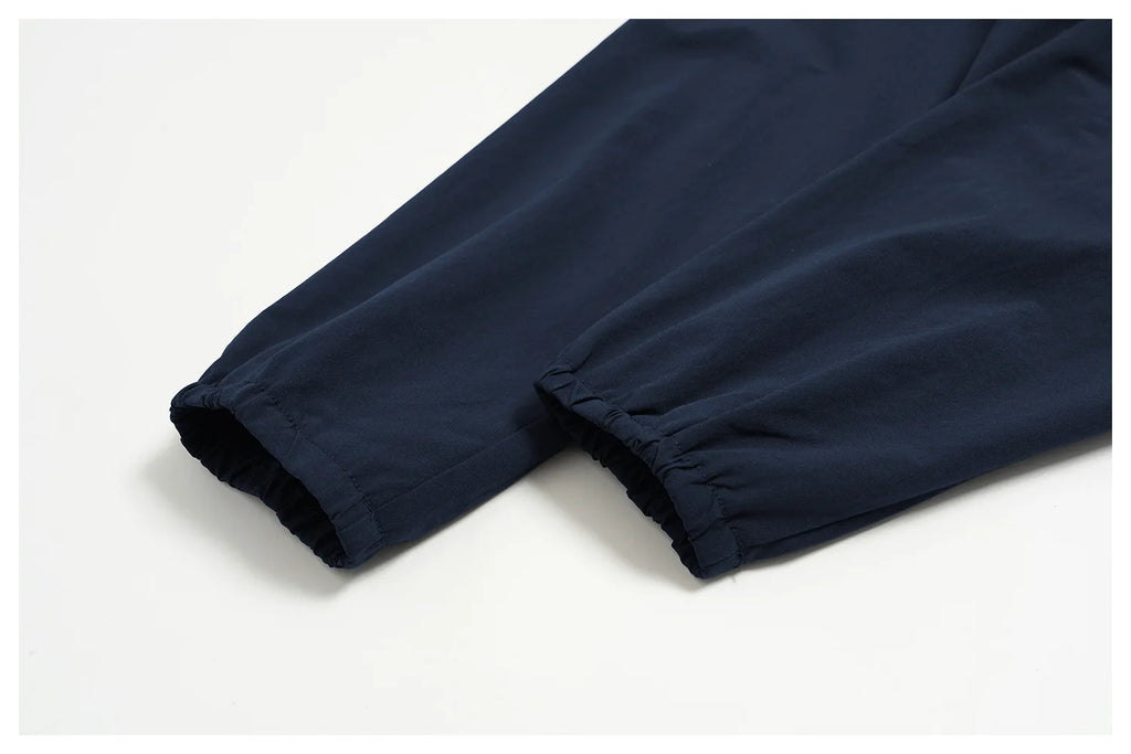 Indigo blue long-sleeve jacket with elasticated sleeve cuff and gathered hem