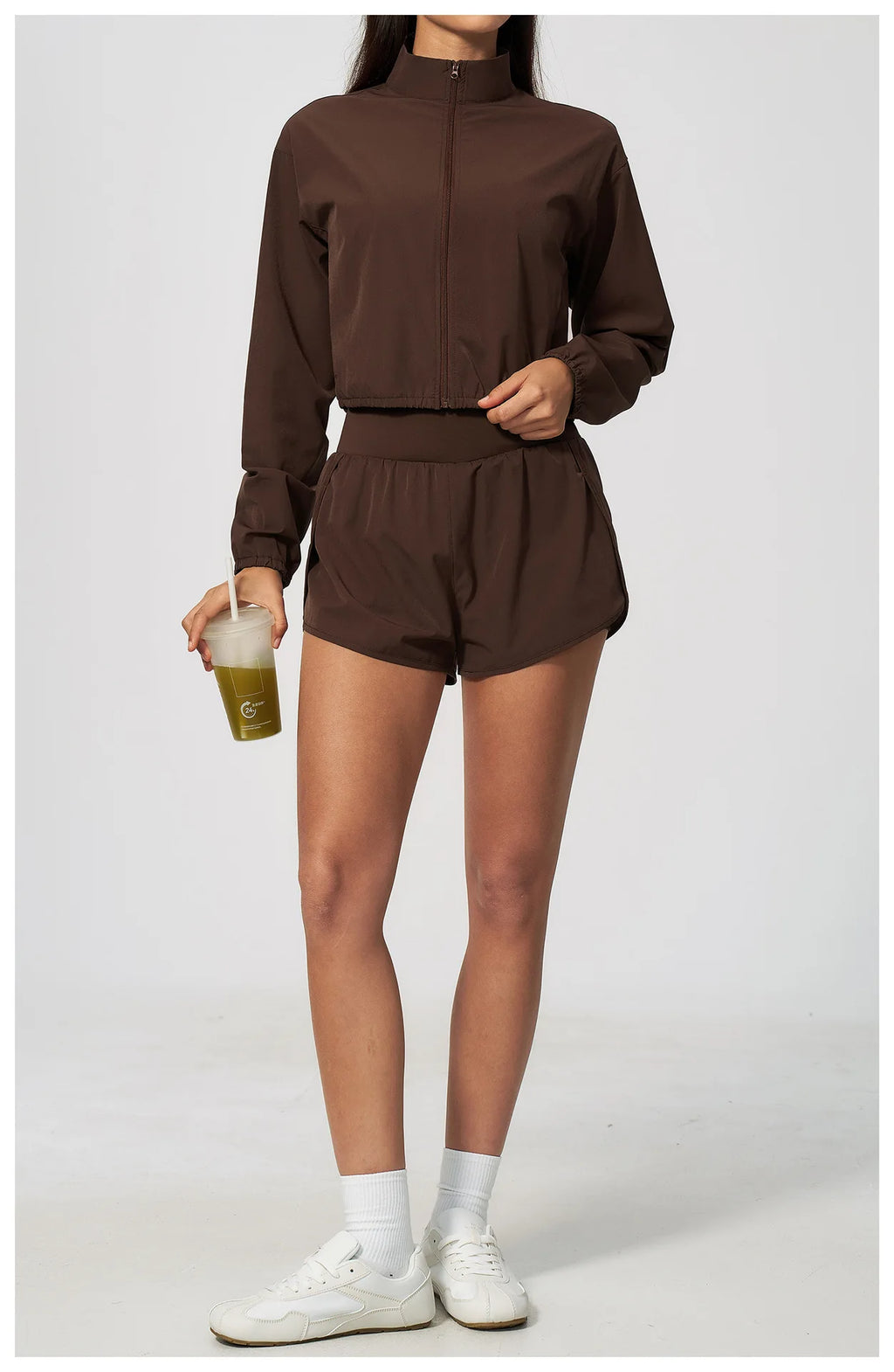 Brown zip-up long sleeve sports jacket with adjustable drawstring waist, stand collar
