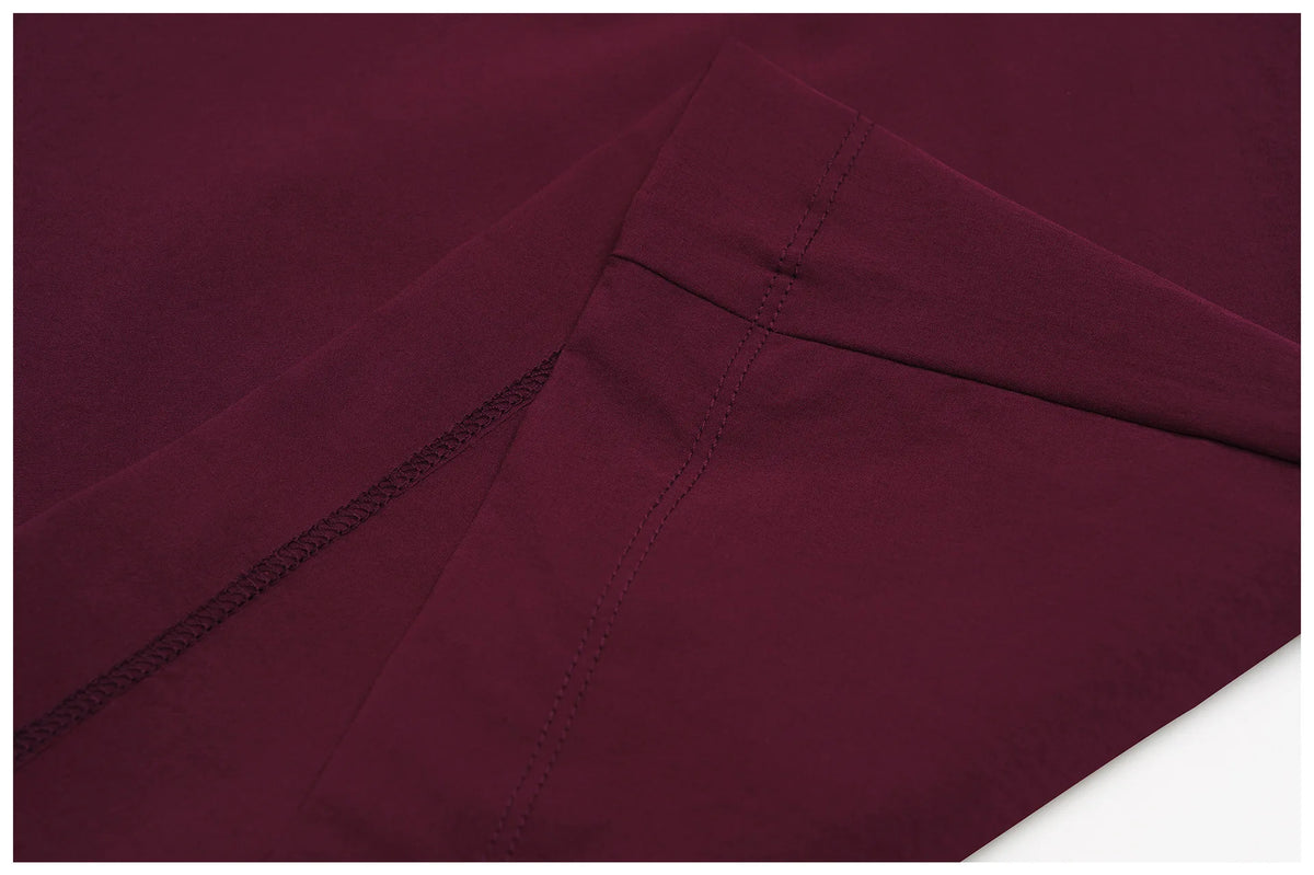 Women's burgundy wide-leg pants with stitched seams and elastic waistband