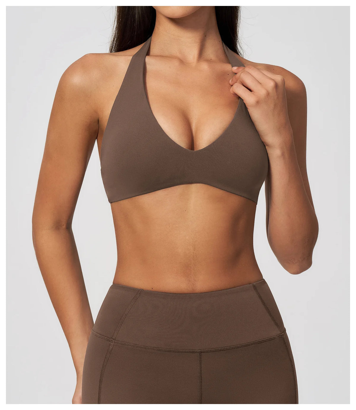 Dark brown halter yoga bra with deep V plunge front, seamless-looking fit