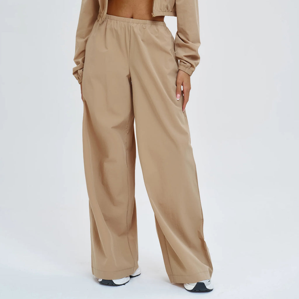 Women's wide-leg sports pants in latte beige with elastic waistband