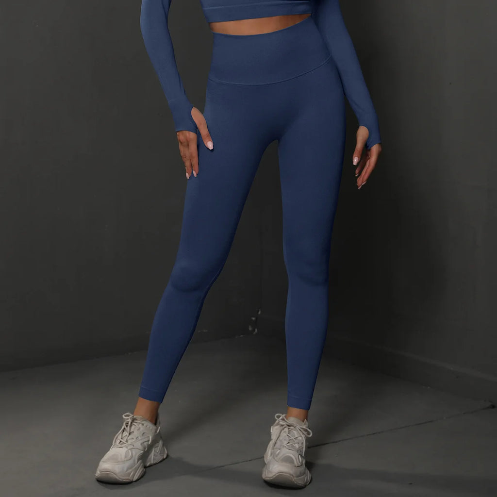 High-waist blue yoga leggings with seamless finish, ankle-length fitted legs.