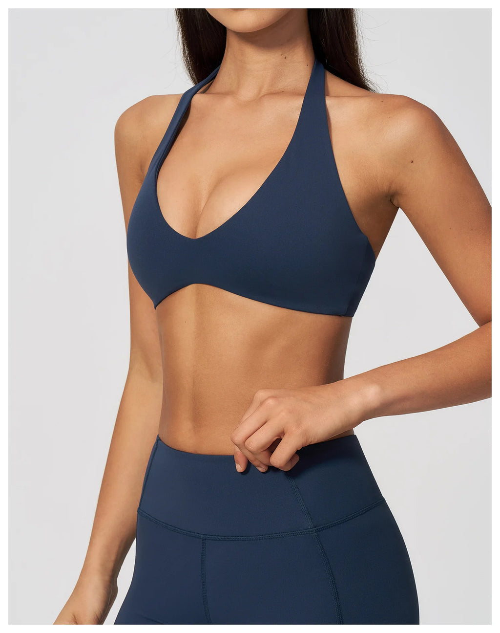 Dark blue halter yoga bra with curved V front and secure underband