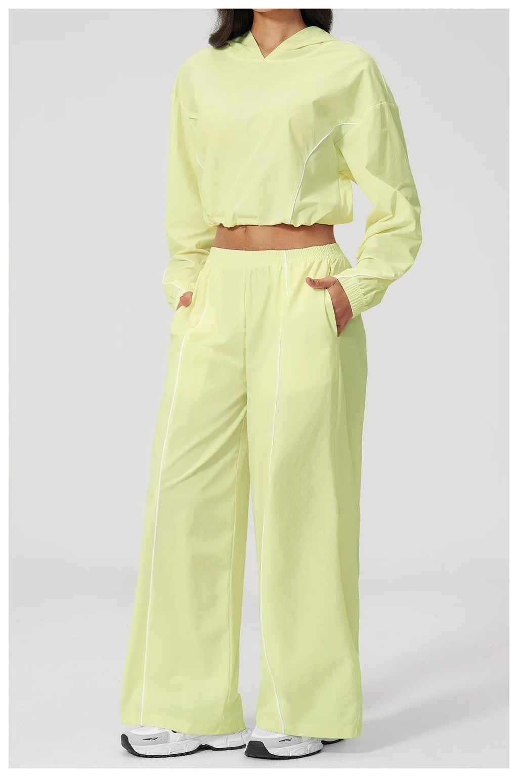 Women’s lemon yellow hooded cropped windbreaker and matching wide-leg pants set