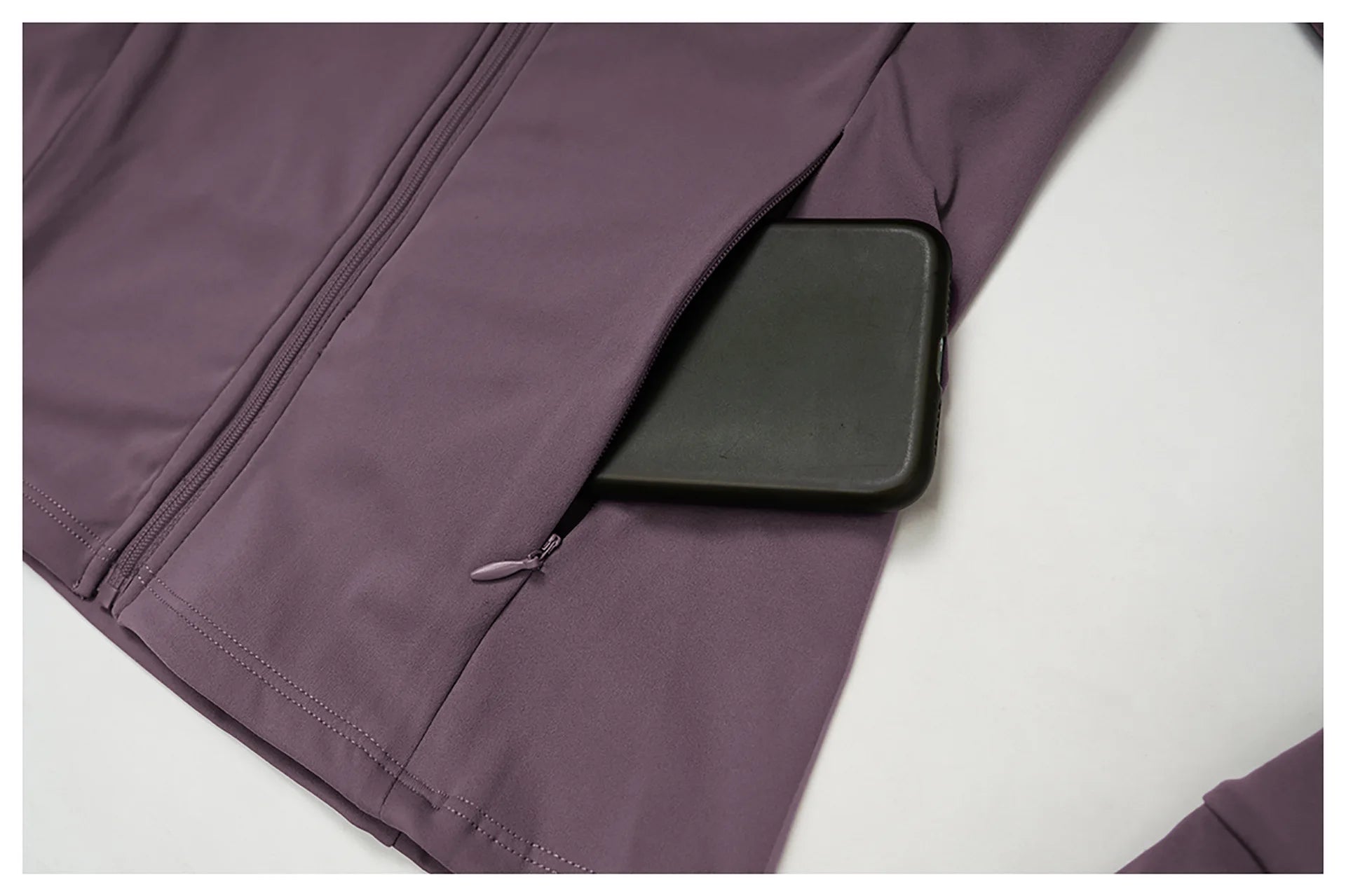Plum jacket sleeve with flap pocket detail