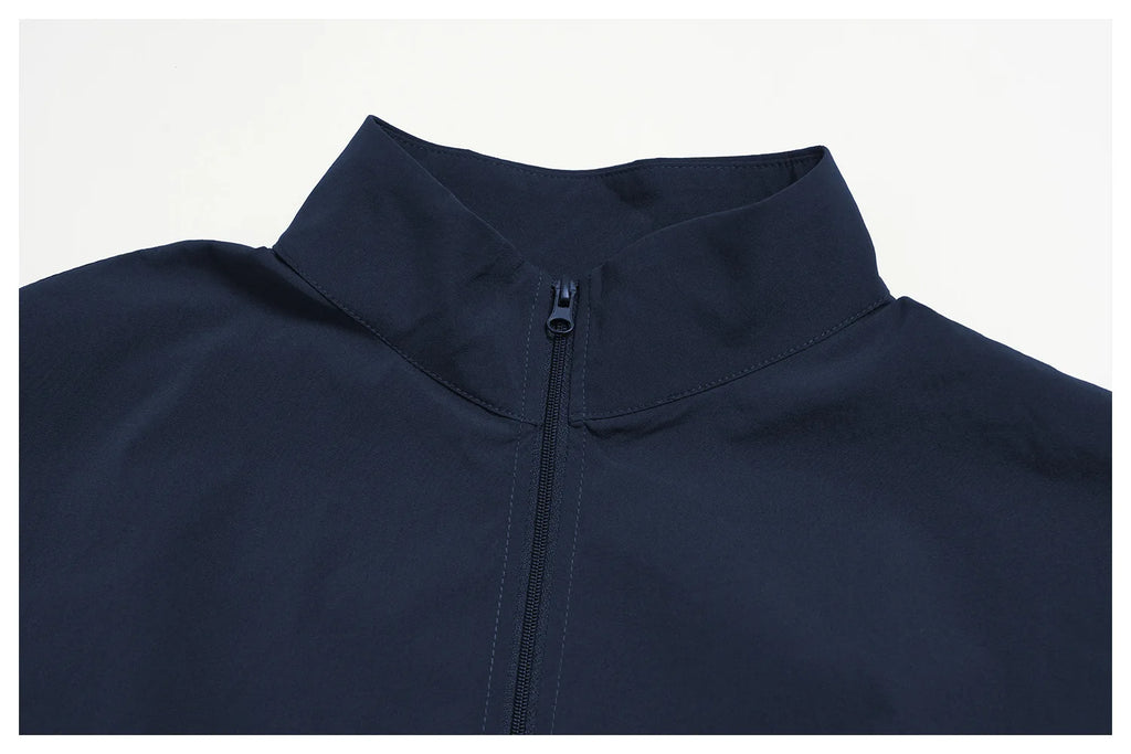 Indigo blue zip-up sports jacket collar close-up with front zipper