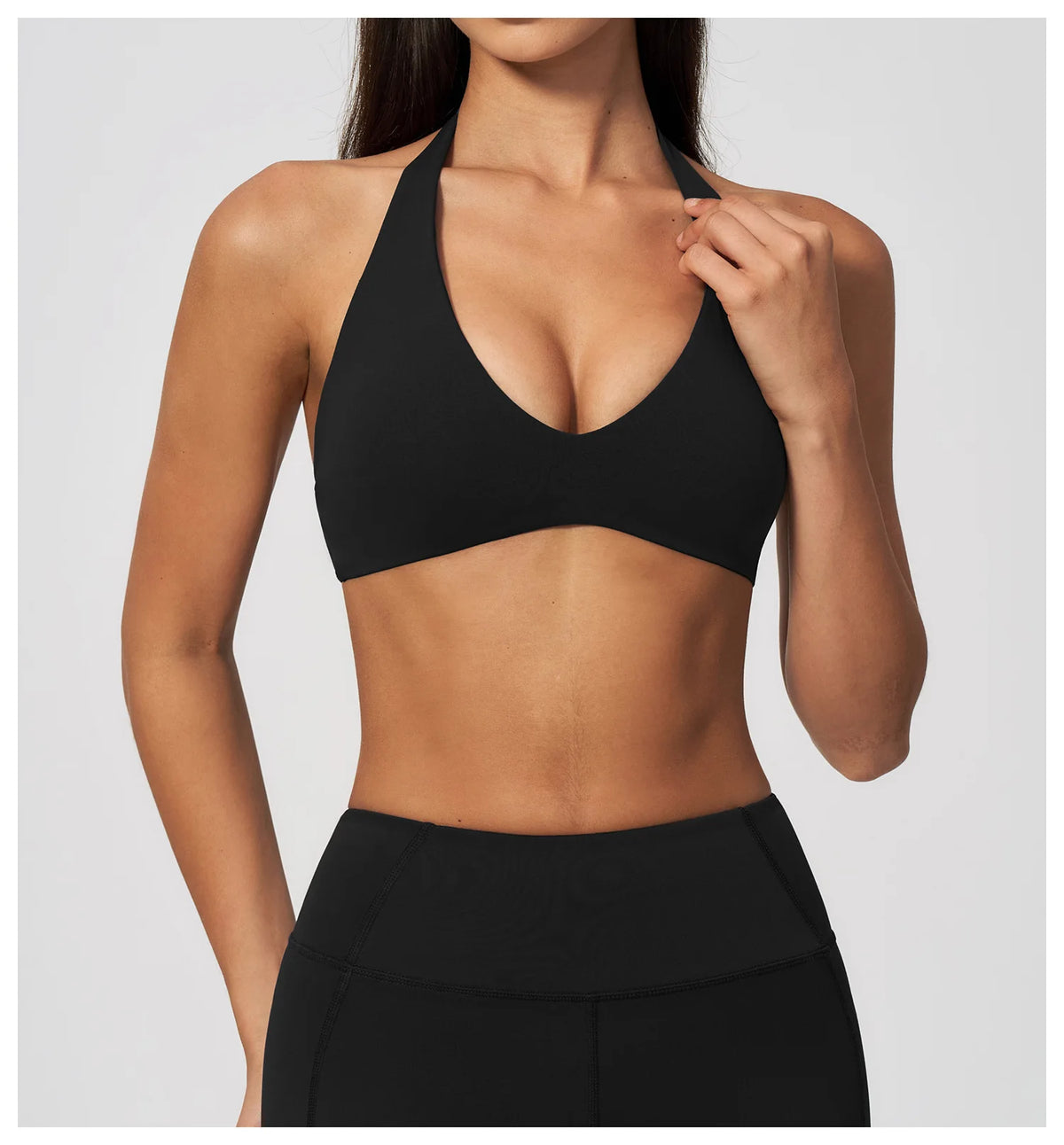 Black halter yoga bra with deep V plunge front, smooth stretch fit