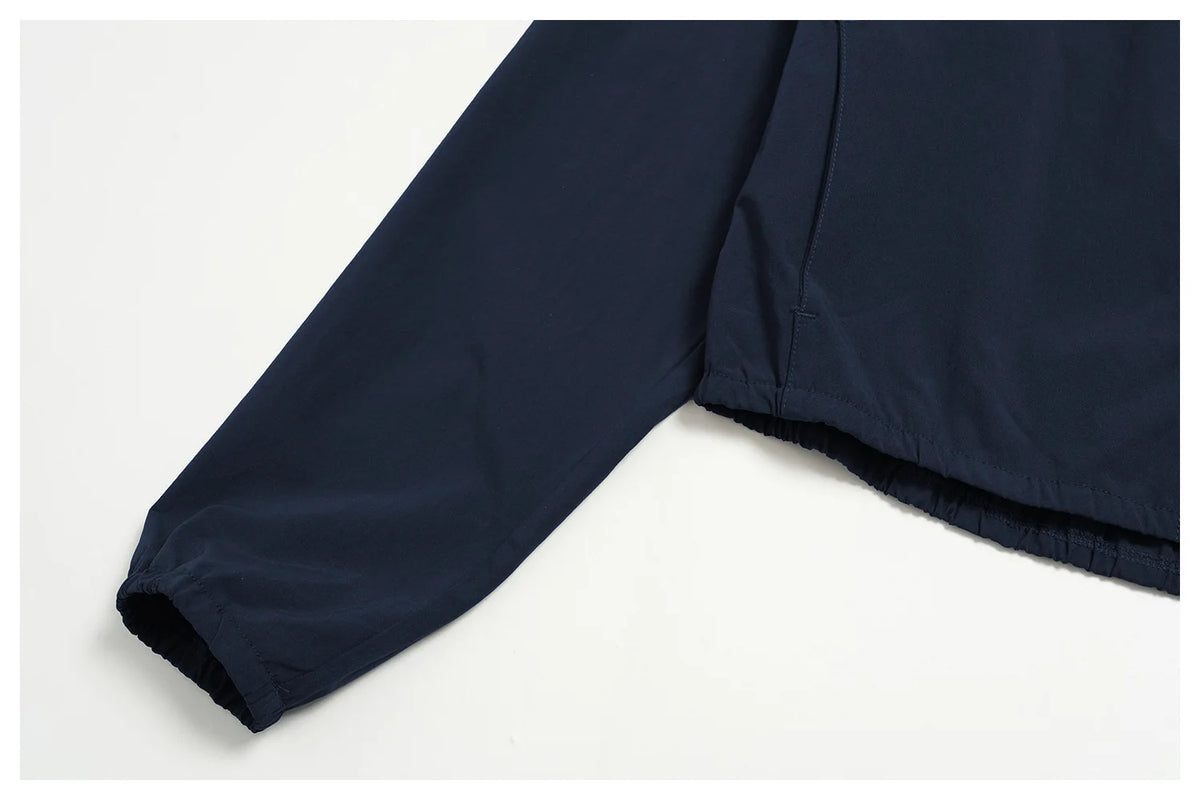 Indigo blue long sleeve sports jacket with elastic sleeve cuff and side seam