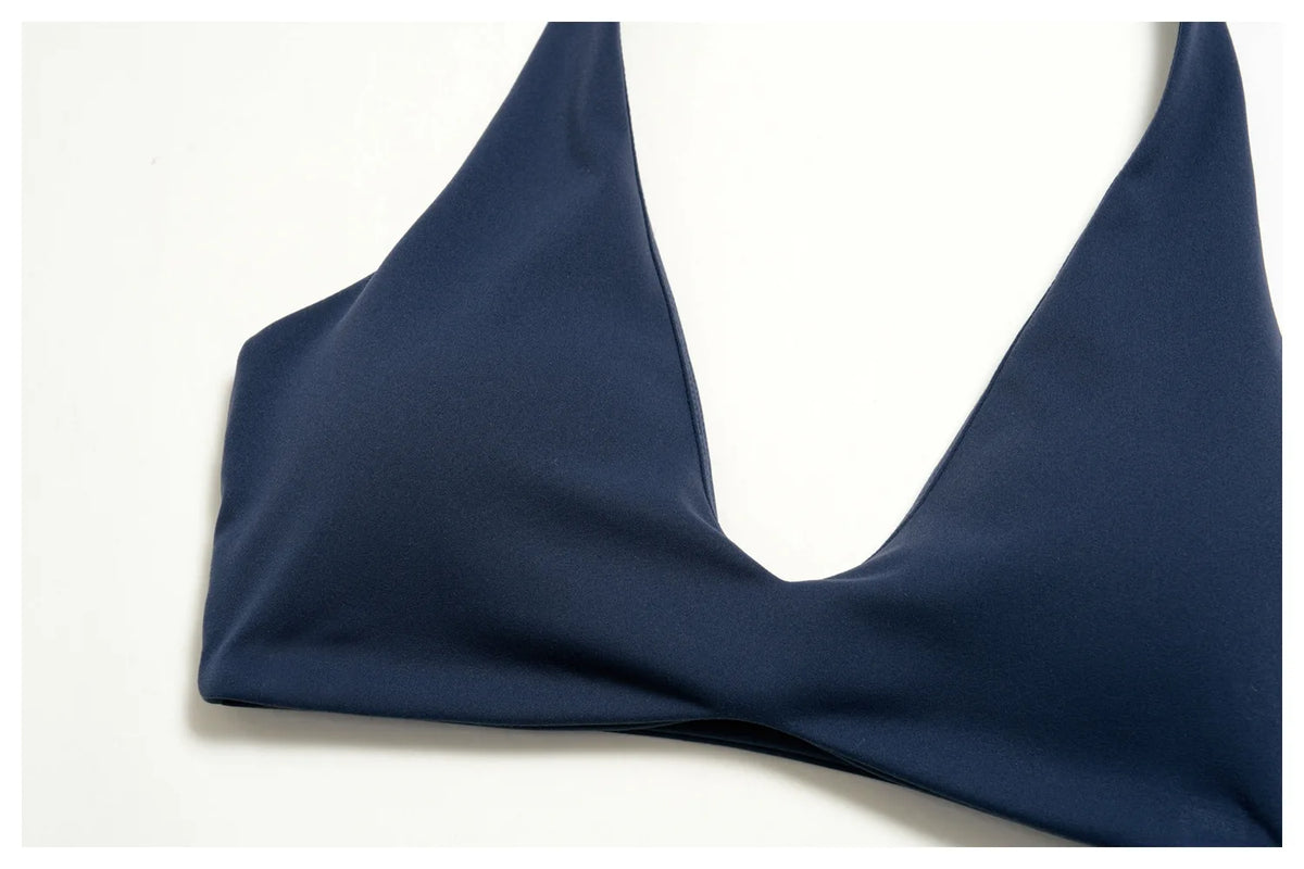 Navy halter yoga bra with deep V neckline and seamless underband