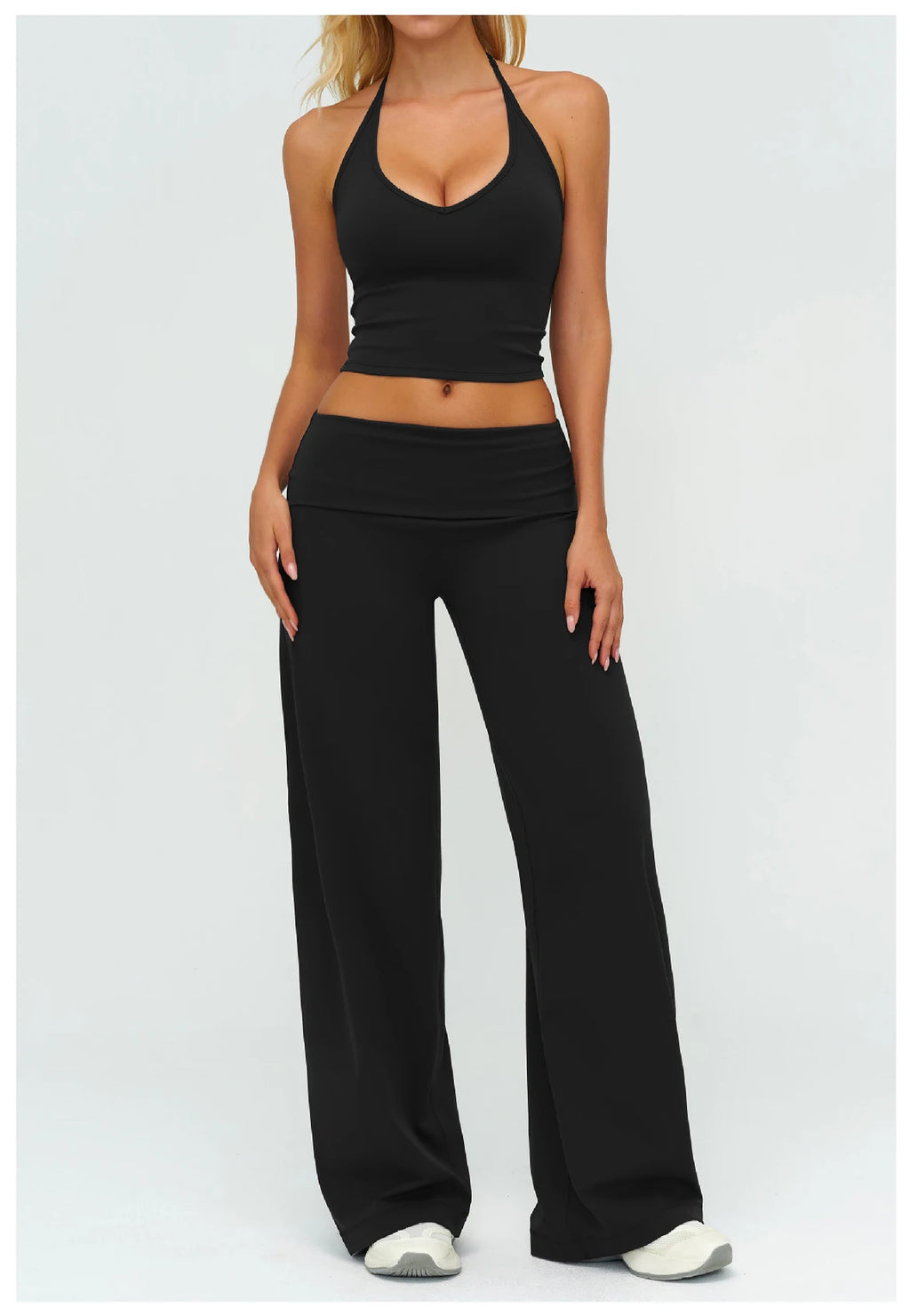Black yoga set: halter sports bra and wide-leg pants, sleeveless midriff cut