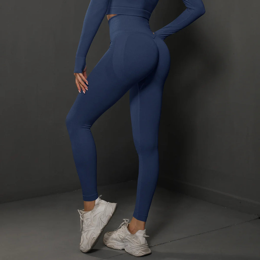 High-waist dark blue yoga leggings with seamless scrunch back and long sleeves