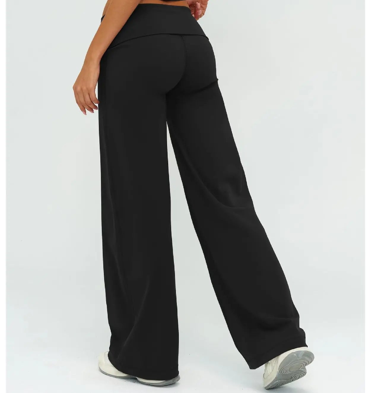 Black flare pants with wide leg and smooth, flat front waistband