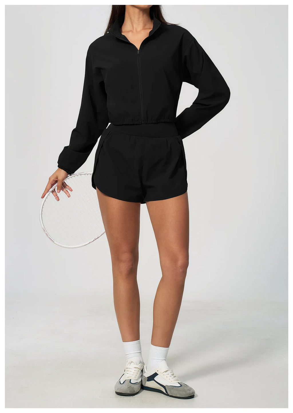Black zip-up long sleeve workout jacket with stand collar and elastic waistband