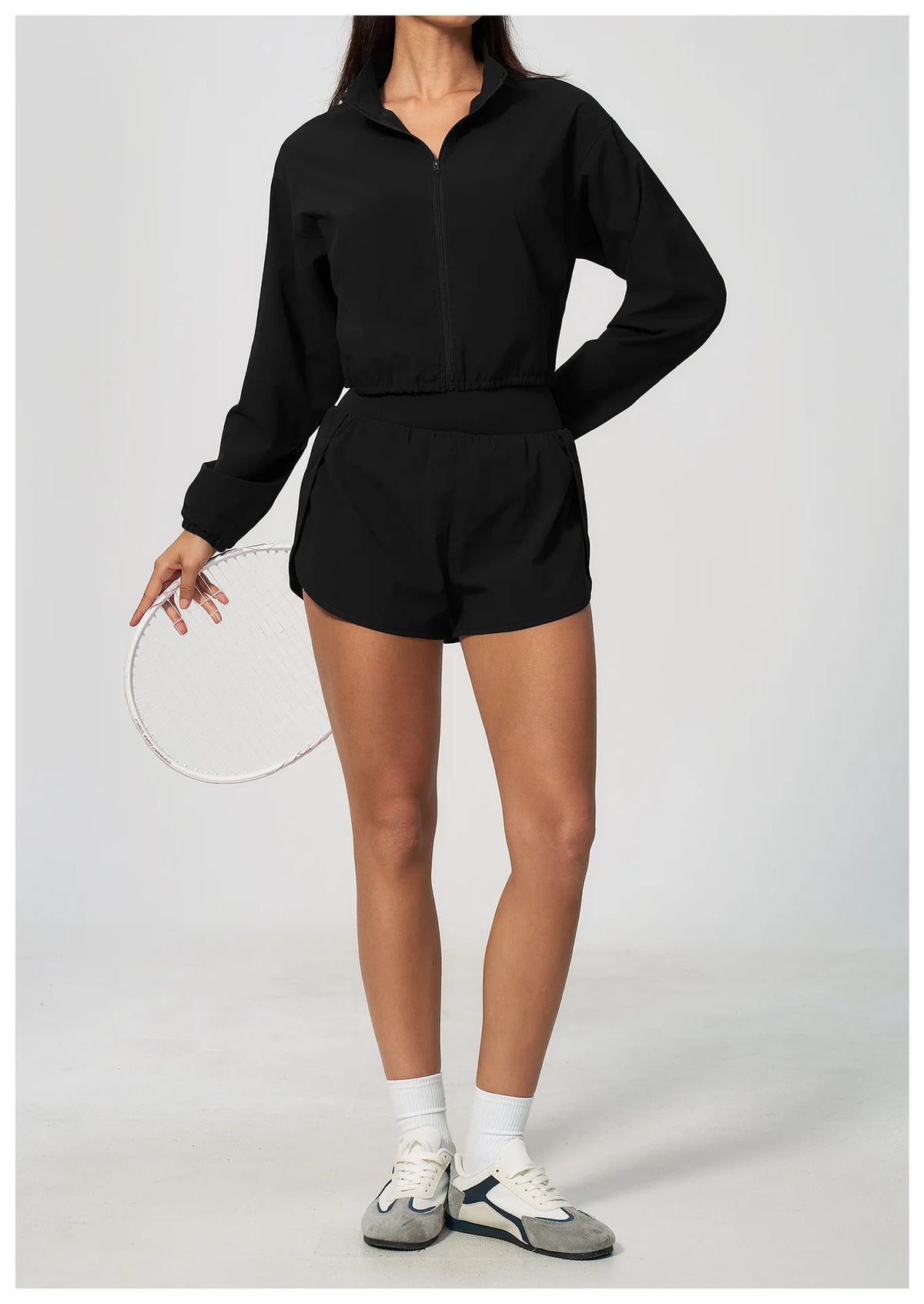 Black zip-up long sleeve workout jacket with stand collar and elastic waistband