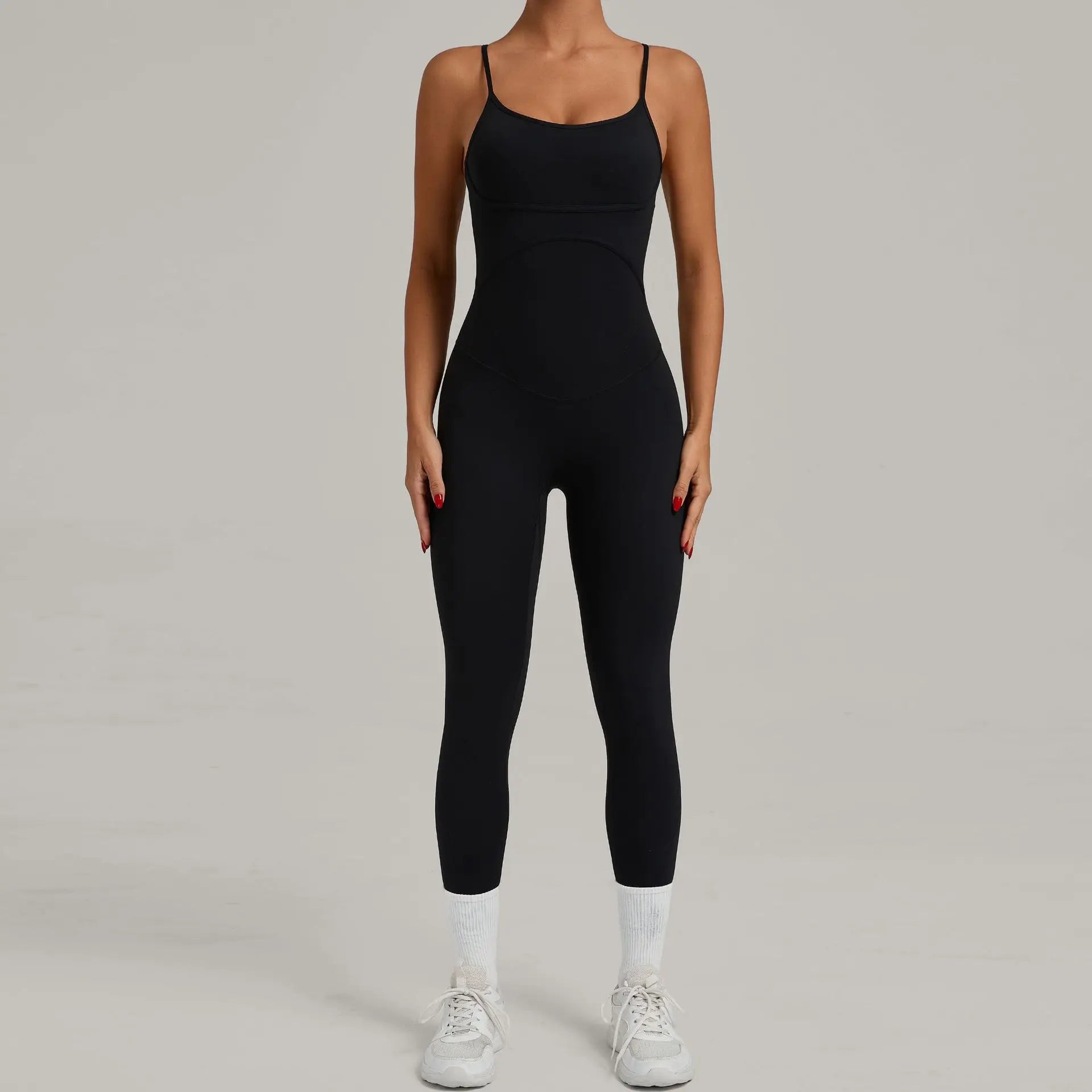 Black yoga jumpsuit with spaghetti straps, full-length straight legs