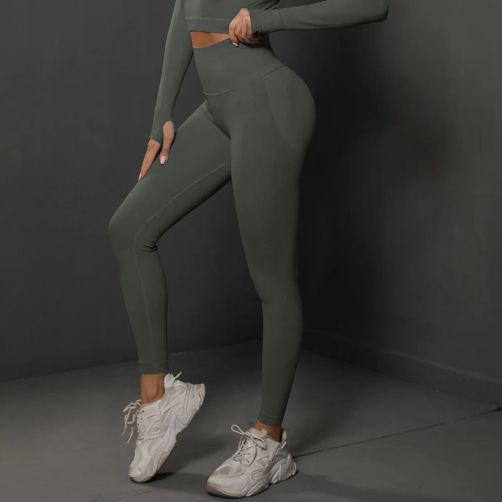 High-waist green yoga leggings with smooth stretch fabric and ankle-length legs.