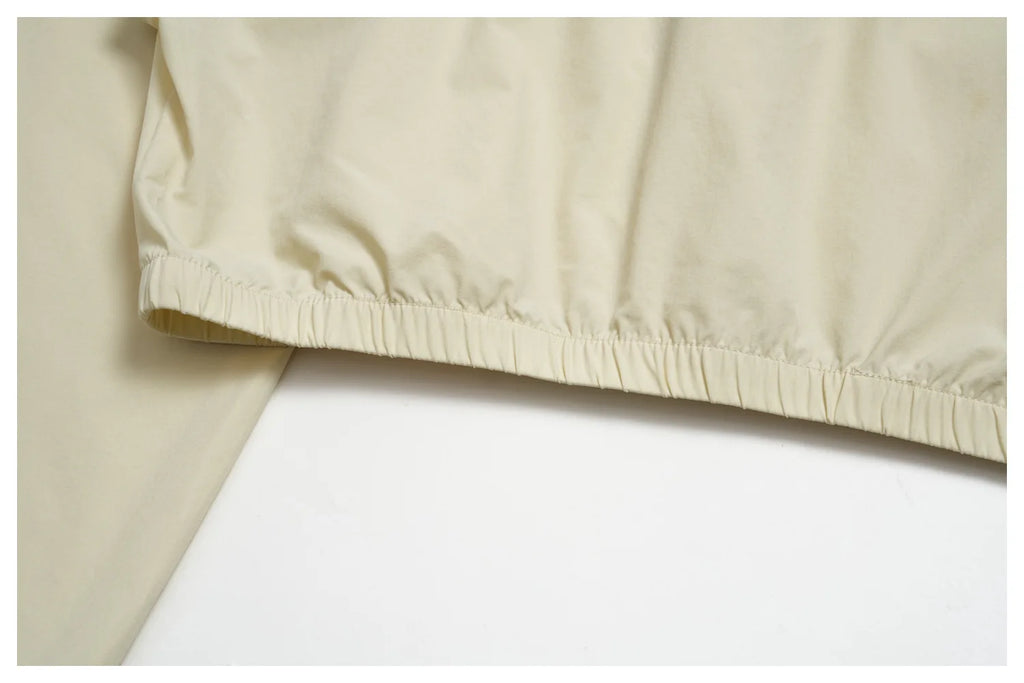 Women’s athletic jacket, light cream with elasticated lower hem and gathers