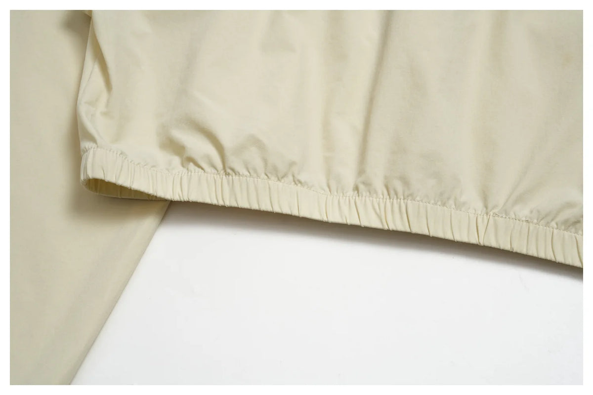Women’s athletic jacket, light cream with elasticated lower hem and gathers