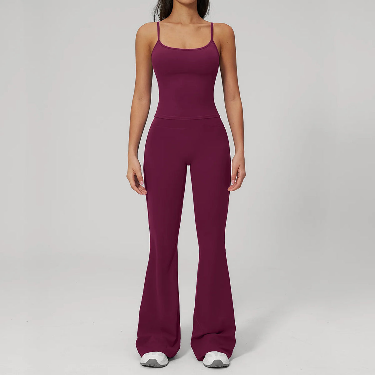 Women’s purple sports tank and flared legging set, front view