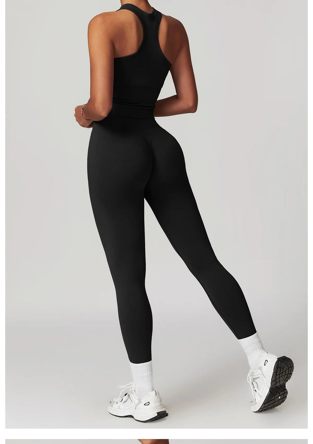 Black racerback tank top and matching leggings set, tapered ankle fit