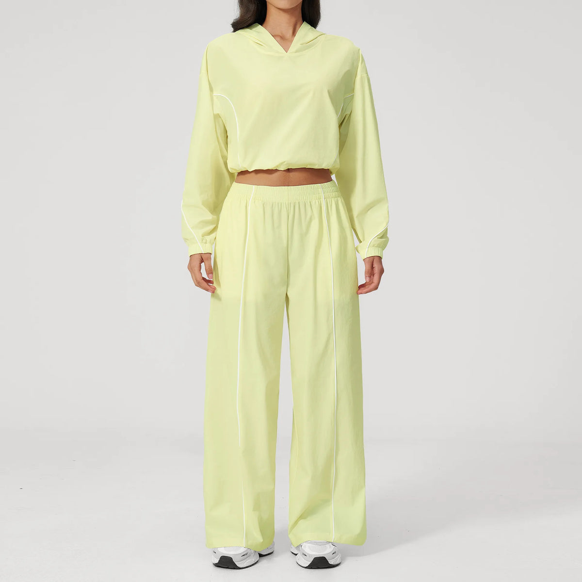 Lemon yellow hooded windbreaker pullover with matching wide-leg pants set