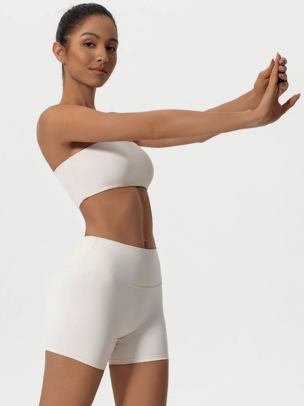Women’s ivory strapless crop sports bra with matching biker shorts