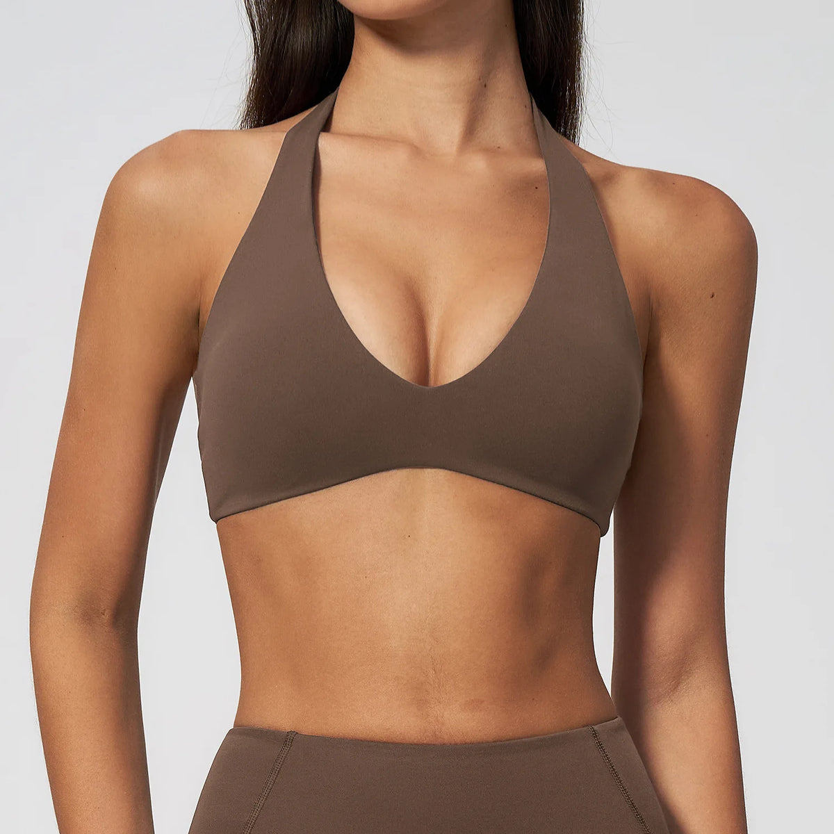 Chocolate brown halter sports bra with deep scoop front and smooth stretch fabric