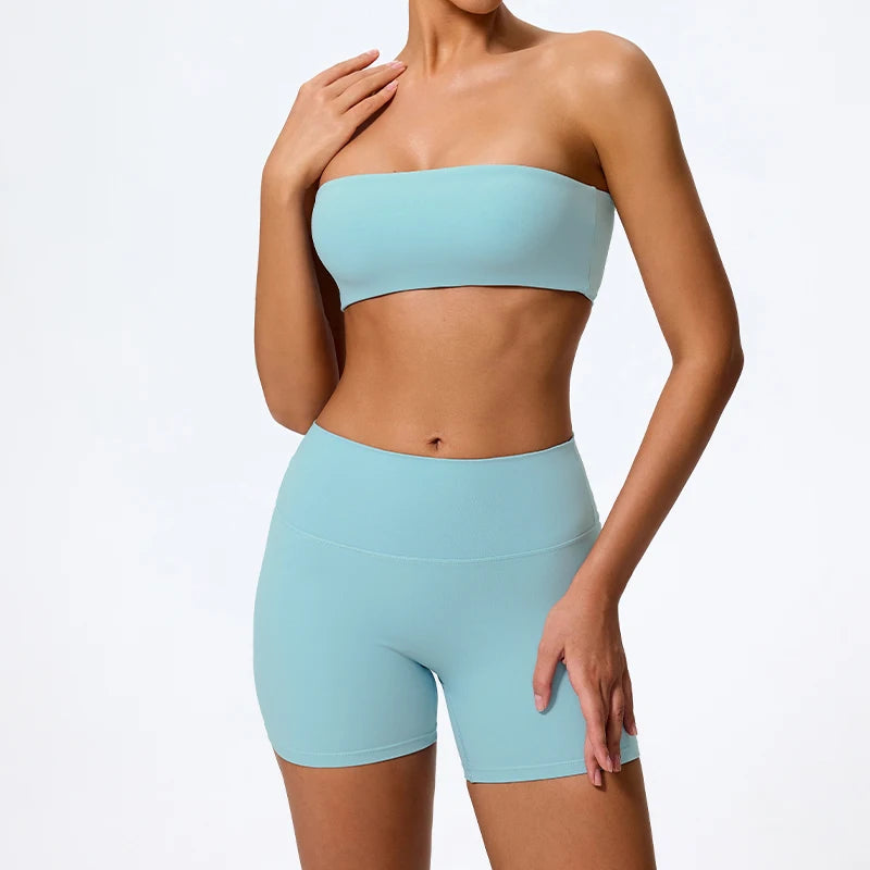 Two-piece fitness set with light blue strapless bandeau bra and matching biker shorts