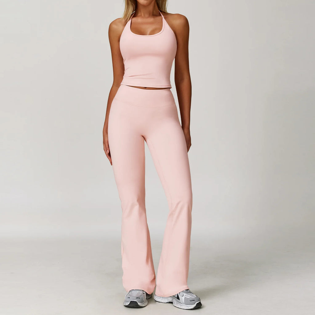 Xooie Fit Two-Piece Set featuring halter tank high-waisted flared pants activewear in soft pink