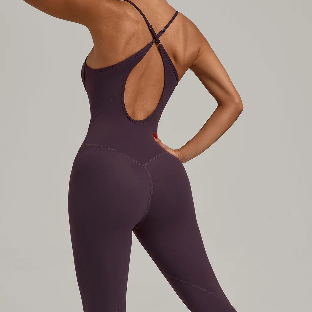 Purple fitted jumpsuit with criss-cross open back and seam stitching