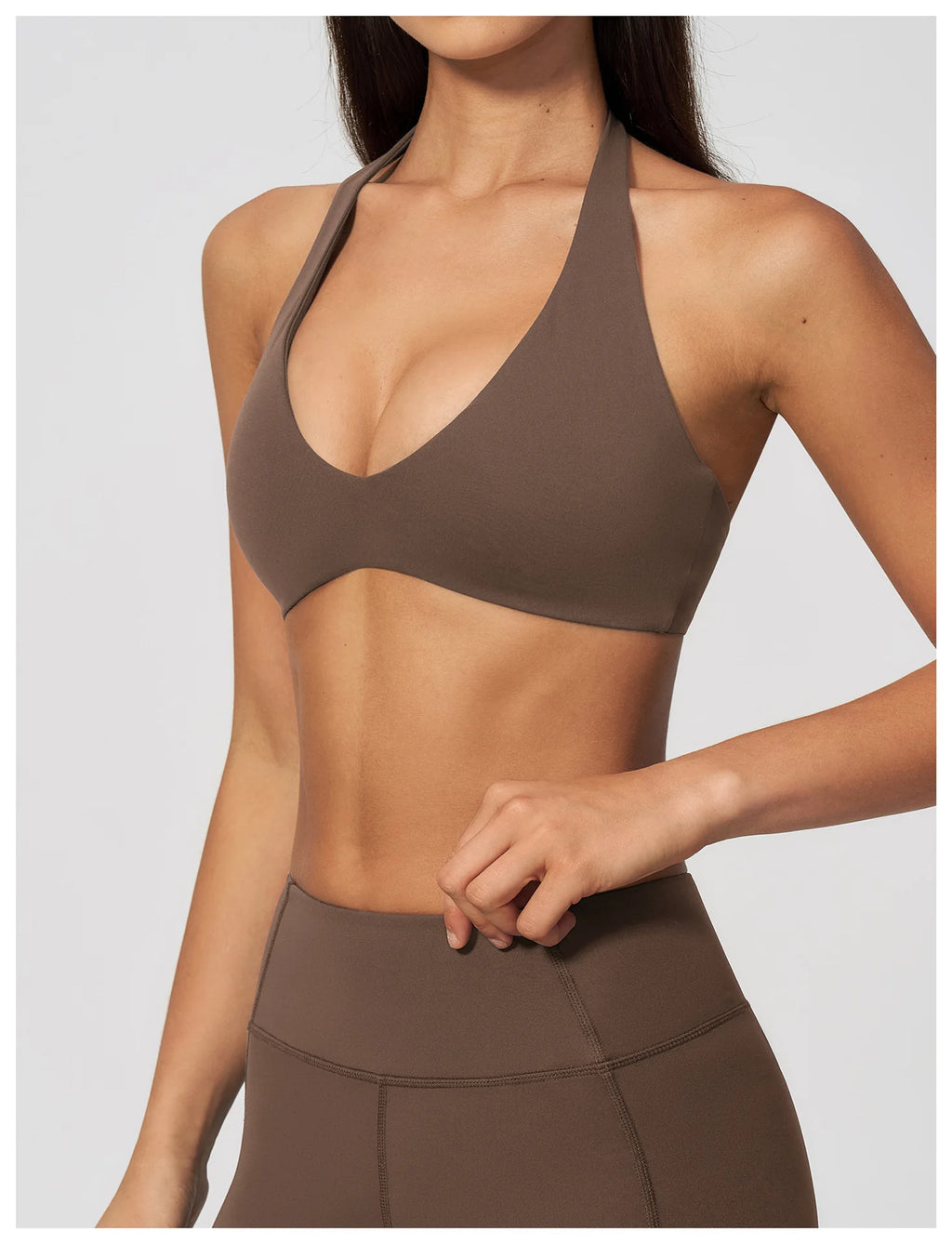 Dark brown halter sports bra with V plunge neckline, smooth stretch fabric