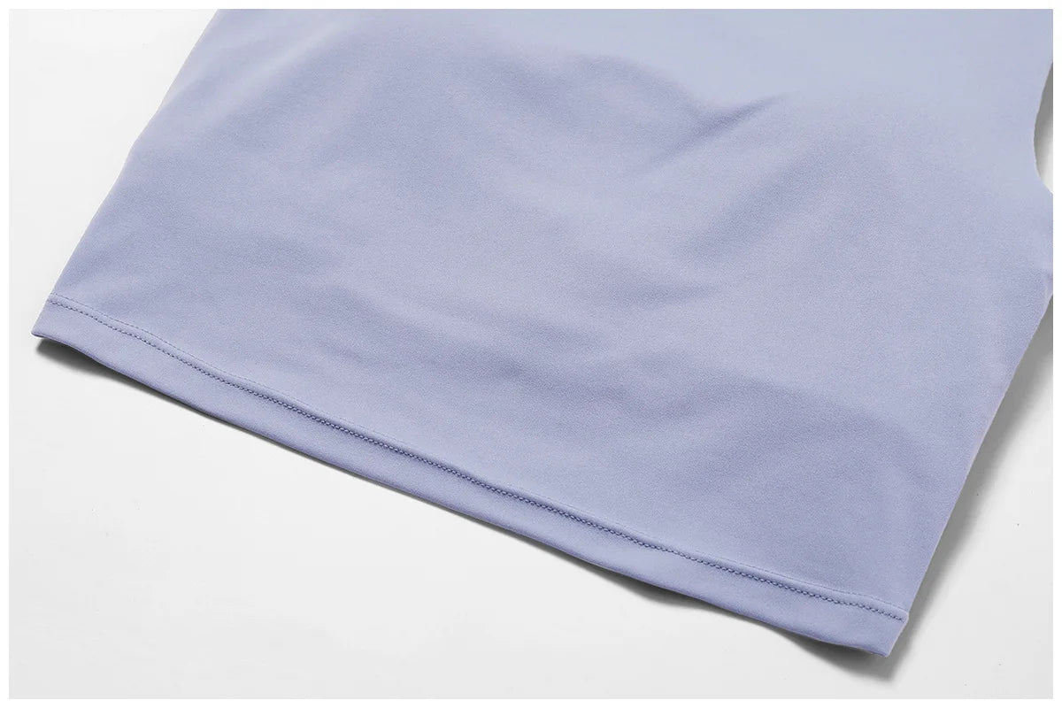 Women’s sports bra crop top in light blue with stitched hem and curved side seam