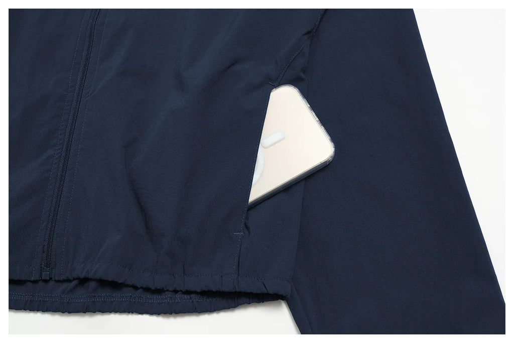 Indigo blue zip-front athletic jacket panel with visible seams and elastic hem