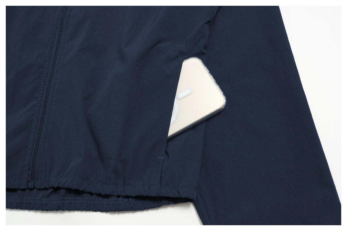 Indigo blue zip-front athletic jacket panel with visible seams and elastic hem